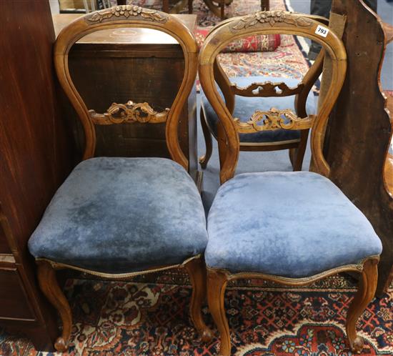 A set of three Victorian walnut salon chairs